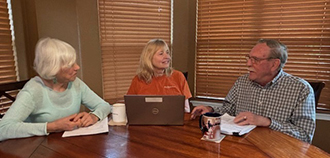 Members of the Health Behavior Research and Training Institute at the Steve Hicks School of Social Work at the University of Texas at Austin discuss plans for a student training event on motivational interviewing